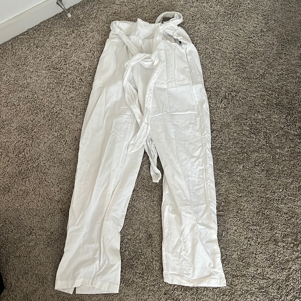 White linen pants with a tie around the waist